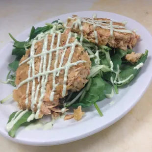 Handmade Salmon Cakes over Baby Spinach with a Wasabi Cream Sauce