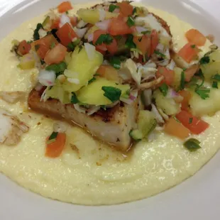 Grilled Mahi over Cheddar Grits topped with a Pineapple Salsa