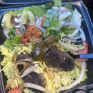 Hard old beef kabobs . Rice was old .