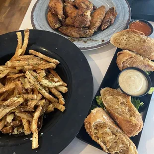 Crab cake egg rolls truffle fries and sweet jerk wings