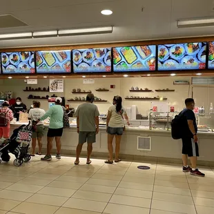 people standing in line to order food