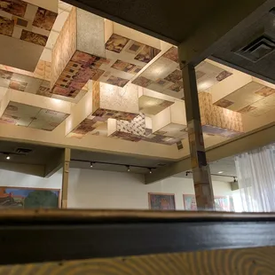 Lovely ceiling and wall paintings in gentle Indian decor.