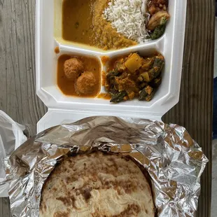 Lentils, okra, fried veggie ball, naan, rice, mini samosa, chutney, etc