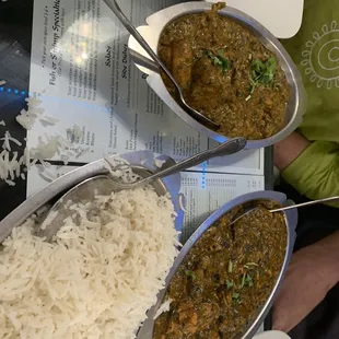 two bowls of food and a plate of rice