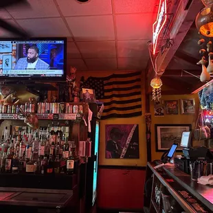a bar with a television in the background