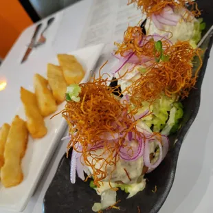 Ceviche frito with a side of fried yuca
