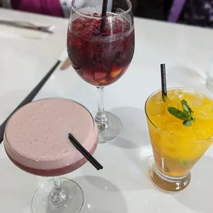Pisco with purple corn, pisco with passion fruit and mint, and their sangria