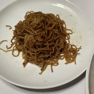 a plate of noodles on a table