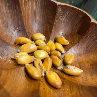 peeled bananas in a wooden bowl