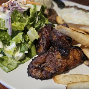 BISTEC A LO POBRE (steak topped with fried eggs and plantains, served with white rice and salad)