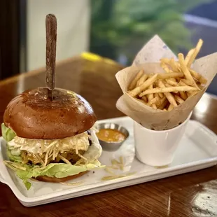 PERUCHA BURGER 100% Angus beef on grilled brioche bun, Munster cheese, fried egg, fried bananas, shoestring fries, onions, lettuce $18