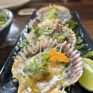 Conchitas a la Parmesana - Peruvian scallops in the half shell, broiled with Parmesan cheese, butter and Pisco