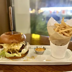 PERUCHA BURGER 100% Angus beef on grilled brioche bun, Munster cheese, fried egg, fried bananas, shoestring fries, onions, lettuce $18