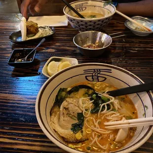a bowl of ramen and chopsticks
