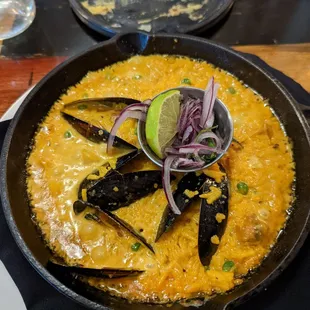 Bubbling hot paella made with Peruvian spices.