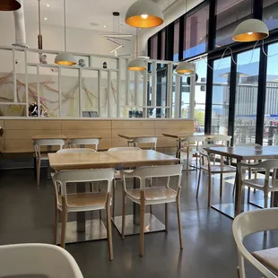 a dining area with tables and chairs