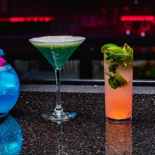 a variety of cocktails on a bar counter