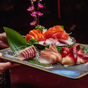 a platter of sushi and sashimi