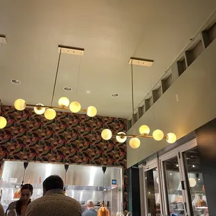 people sitting at a restaurant counter