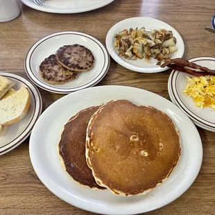 1 Egg with Bacon, short stack, home fries, sausage patties with sourdough bread