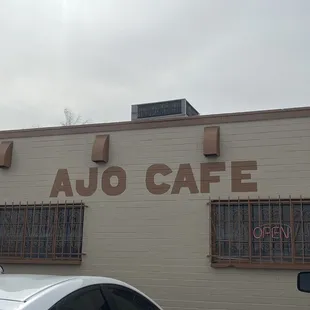 two cars parked in front of the building