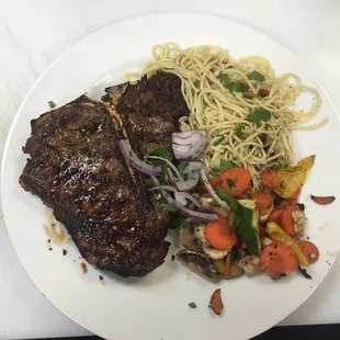 T-Bone steak with pasta and grilled vegetables