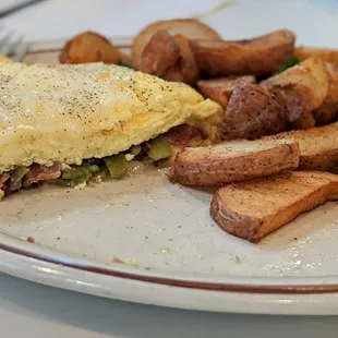 Bacon and green chile omelette with country potatoes+ two pancakes