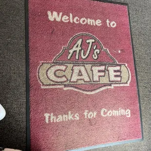 a welcome mat on the floor