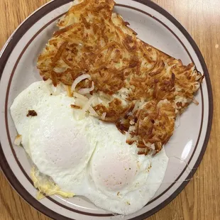 Eggs and hash browns (sourdough toast on the side not pictured)