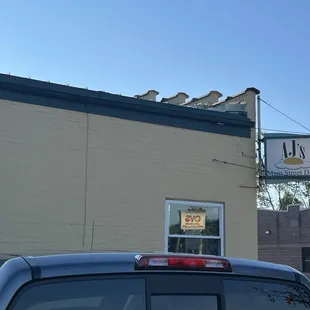 a car parked in front of the restaurant