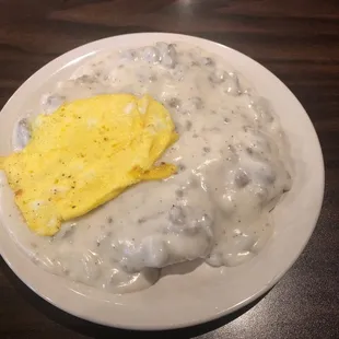 Biscuits and gravy with an egg.