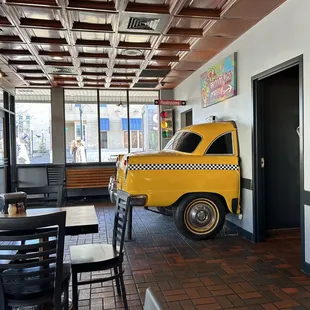 a taxi cab in the dining room