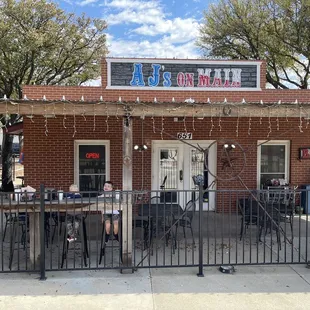 The outdoor seating in front of AJ's.