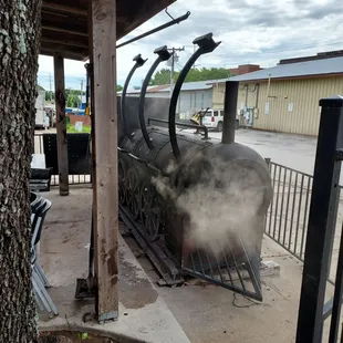Smoking the meat.  Hard to pass this place by when you're smelling this.