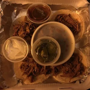 4 mini tacos for $5.99 &amp; I chose beans as side. She asked if I wanted sauce or jalapeños so I guess everyone gets onions standard.