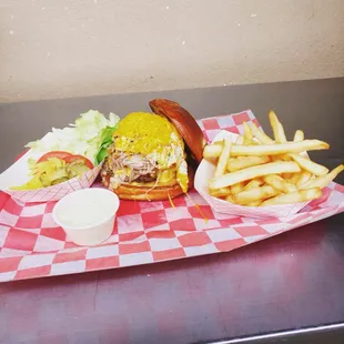 Fried egg bacon cheeseburger with pulled pork on top!