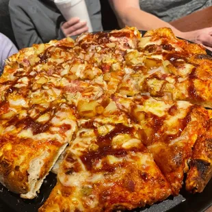 Mountain bbq pizza with pineapple added to it.