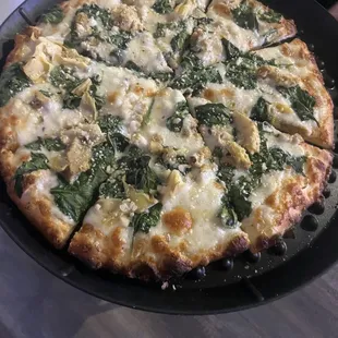 White Combination Pizza - Chicken, Spinach, artichoke hearts with an Alfredo sauce