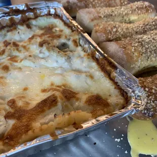 Breadsticks and white sauce pasta