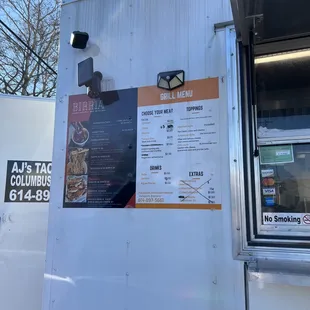a menu on a food truck