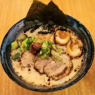 Tonkotsu Ramen - Rich creamy ramen with homemade brazed pork. This picture has seasoned half-boiled eggs and special spicy paste