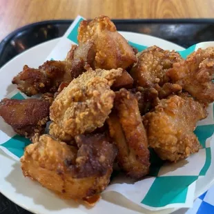 Ajun Cajun Chicken (side) marinated and fried chicken thighs