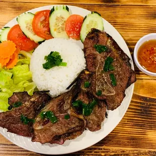 hearty plate of pork chop rice and sweet-and-spicy fish sauce