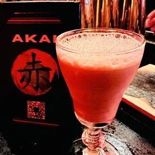 a drink in a glass on a bar