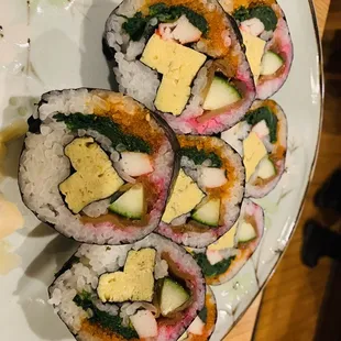 four pieces of sushi on a plate