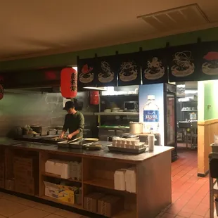 a man preparing food in a kitchen