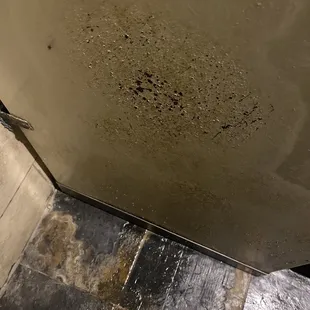 a person standing in a dirty bathroom