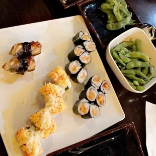 Shrimp Tempura, edamame, salmon roll, eel sushi and volcano roll