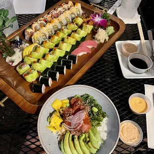 a plate of assorted sushi on a table