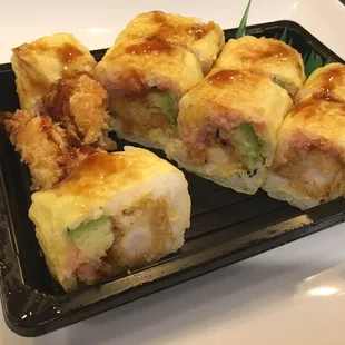 Golden Age! Try it! Tempura shrimp, avocado, tuna and mango in yellow soy paper - $11.99 - Great value for this side of town.